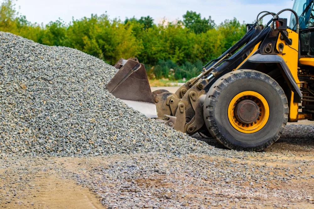 Wheel loader working a stockpile of crushed gravel
